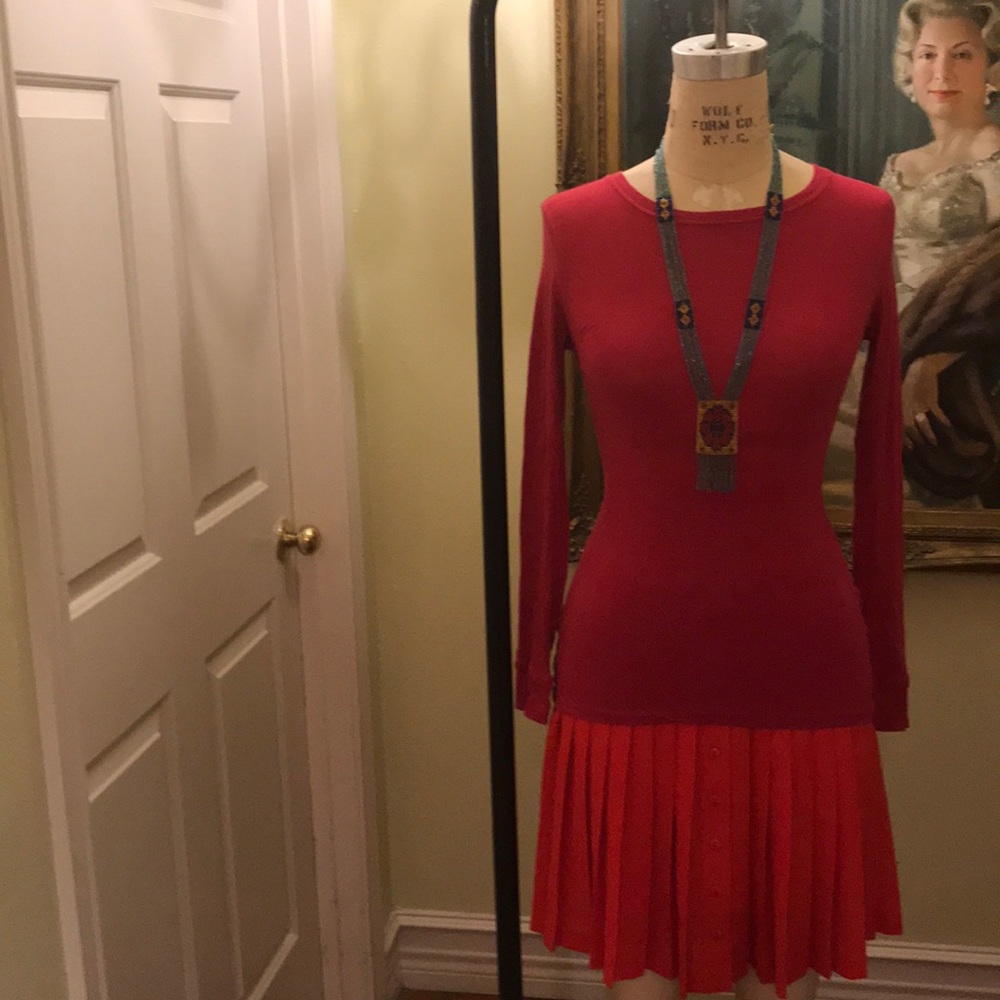 Pink top and red pled skirt